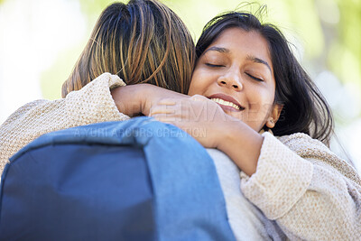 Buy stock photo Happy students, backpack and hug in park, garden or school campus bonding, friends acceptance or community support. Smile, Indian and women in embrace on university college for good luck or thank you