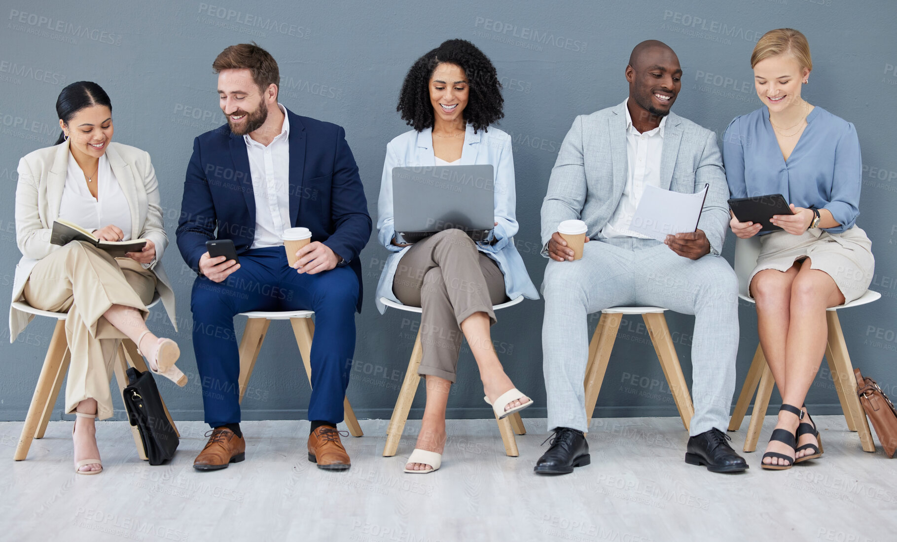 Buy stock photo Business people, diversity and networking in row for collaboration, teamwork or preparing corporate meeting. Group of diverse designers sitting in waiting room working with technology in team startup