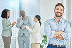 Happy, expert and portrait of a businessman with arms crossed in a coworking office. Pride, manager and professional employee with confidence, motivation and executive at a corporate company