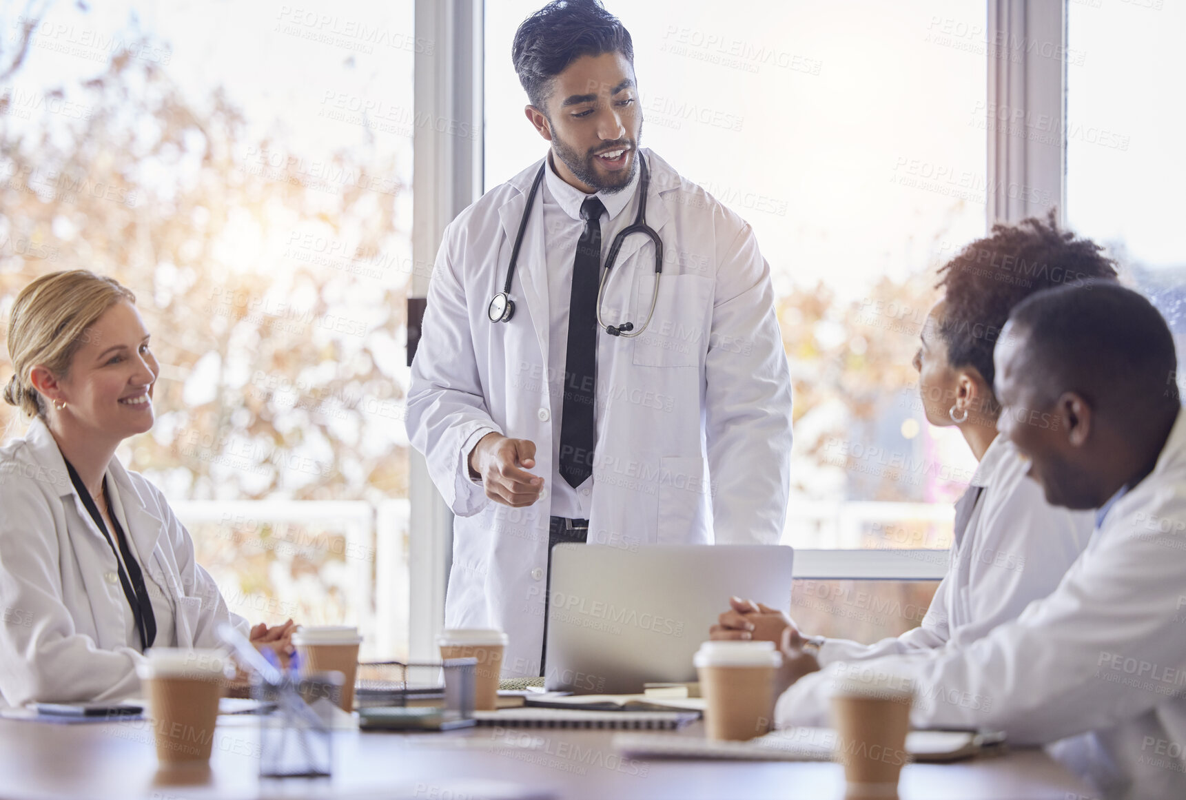 Buy stock photo Indian doctor, medical collaboration and discussion in a hospital conference room with diversity. Work conversation, healthcare and wellness team talking about teamwork idea and insurance strategy