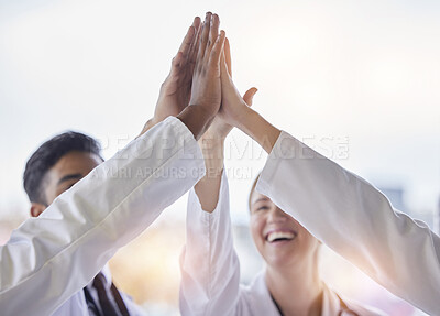 Buy stock photo Doctor, group high five and teamwork with hands, celebration and motivation in hospital for healthcare. Man, woman and medic team building with support, solidarity and diversity in clinic for goal