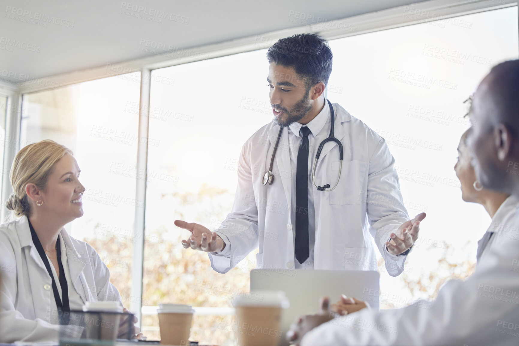 Buy stock photo Indian doctor, medical collaboration and discussion in a hospital conference room with diversity. Work conversation, healthcare and wellness team talking about teamwork idea and insurance strategy