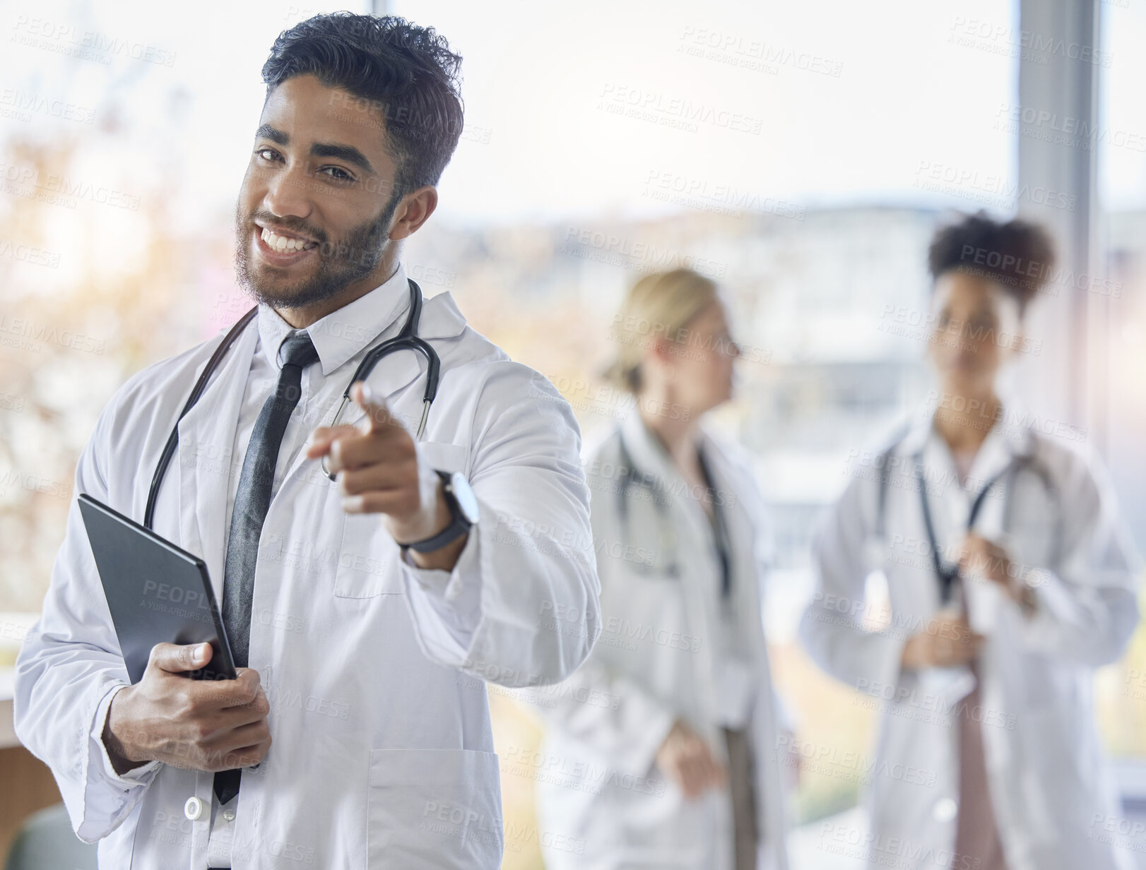 Buy stock photo Indian doctor, portrait and healthcare worker pointing at you  for we are hiring. Medical staff, hospital employee and happy smile of a young intern ready for working in clinic recruitment on tablet