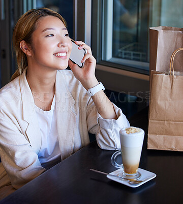 Buy stock photo Phone call, shopping bag and Asian woman in cafe with coffee talking, chatting and social conversation. Communication, fashion and happy girl on smartphone for discount news, retail and sale in mall