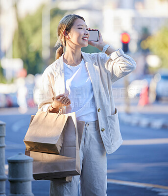 Buy stock photo Phone call, shopping bag and smile of Asian woman with mobile mockup screen on city street. Retail customer, chat and happiness of a young person with paper bags from shop sale or store discount