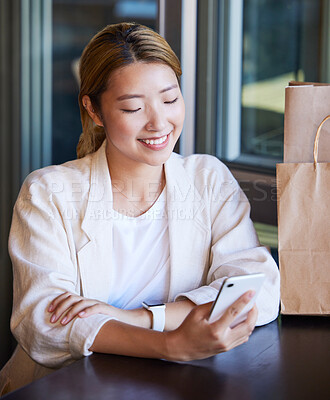 Buy stock photo Phone, shopping and Asian woman in restaurant with smile for product deal, ecommerce and sale. Technology, fashion and happy girl on smartphone for text message, social media and website in mall