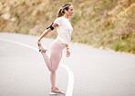 Runner, leg stretch and woman in a road with music for fitness, cardio and mindset preparation. Girk, stretching and n=running in nature with podcast, radio or wellness motivation track for workout