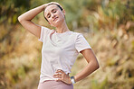 Runner, neck pain and woman in nature for fitness with problem, ache or inflammation. Sports, headache and girl suffering fibromyalgia, arthritis or fatigue while on cardio, workout or run in forest