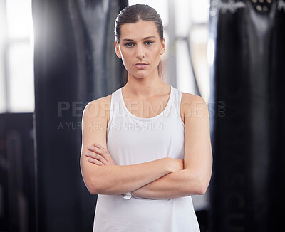 Buy stock photo Portrait, fitness and boxing with a sports woman in a gym, standing arms crossed feeling serious or confident. Exercise, training and focus with a female boxer or athlete standing in a health studio