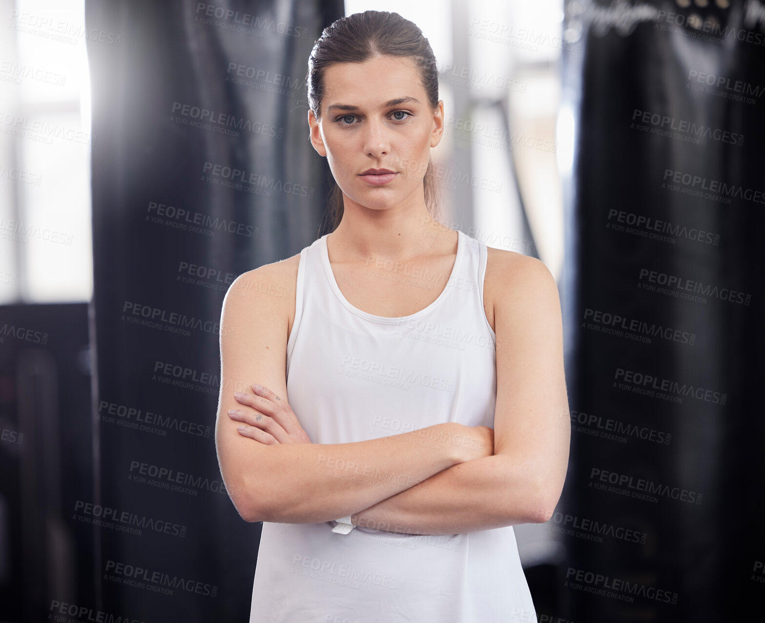 Buy stock photo Portrait, fitness and boxing with a sports woman in a gym, standing arms crossed feeling serious or confident. Exercise, training and focus with a female boxer or athlete standing in a health studio