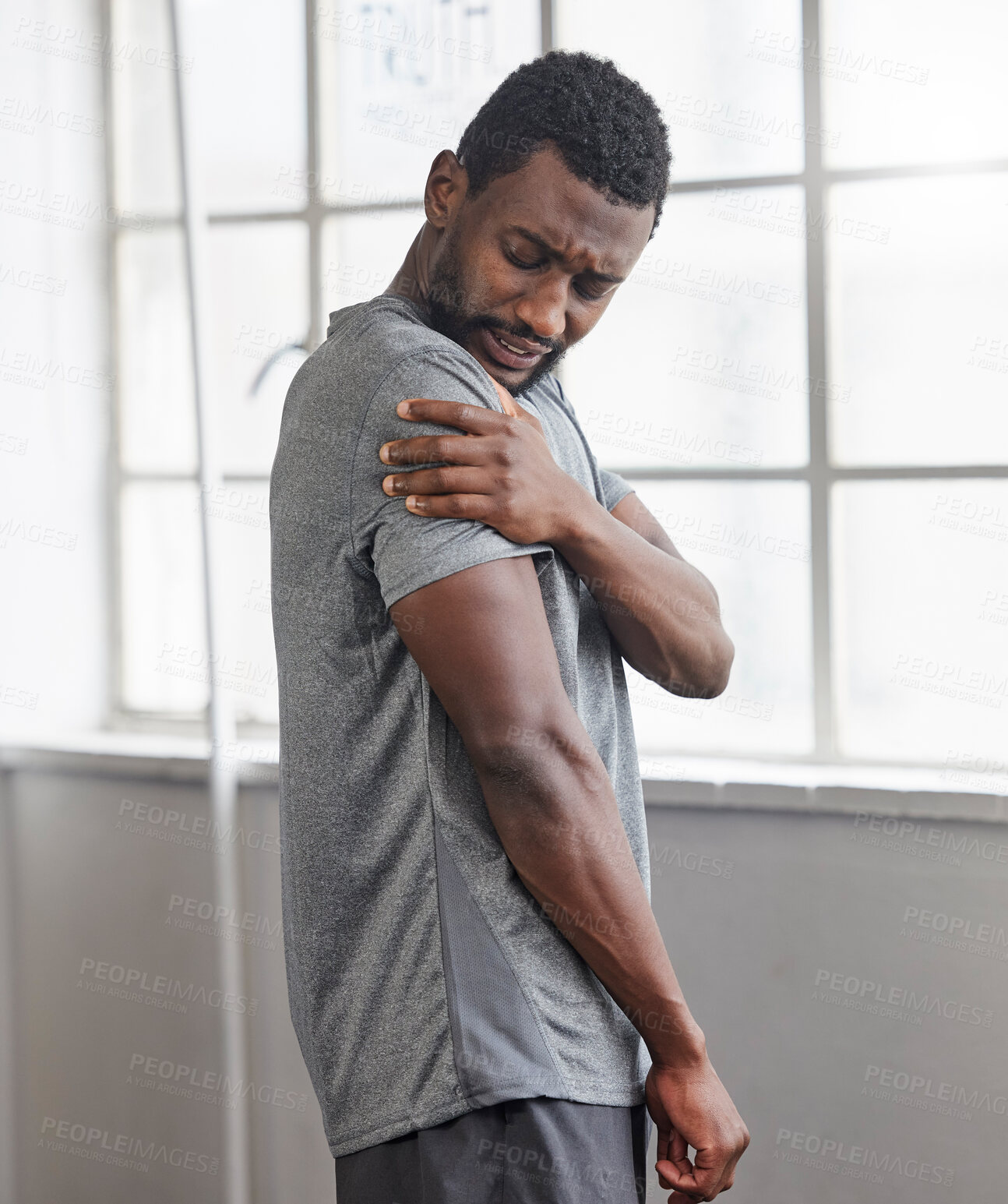 Buy stock photo Shoulder injury, black man and pain in gym from exercise, medical emergency and injured muscle, bruise or joint. Male, arm and fitness accident from workout, first aid and health risk in sports club 