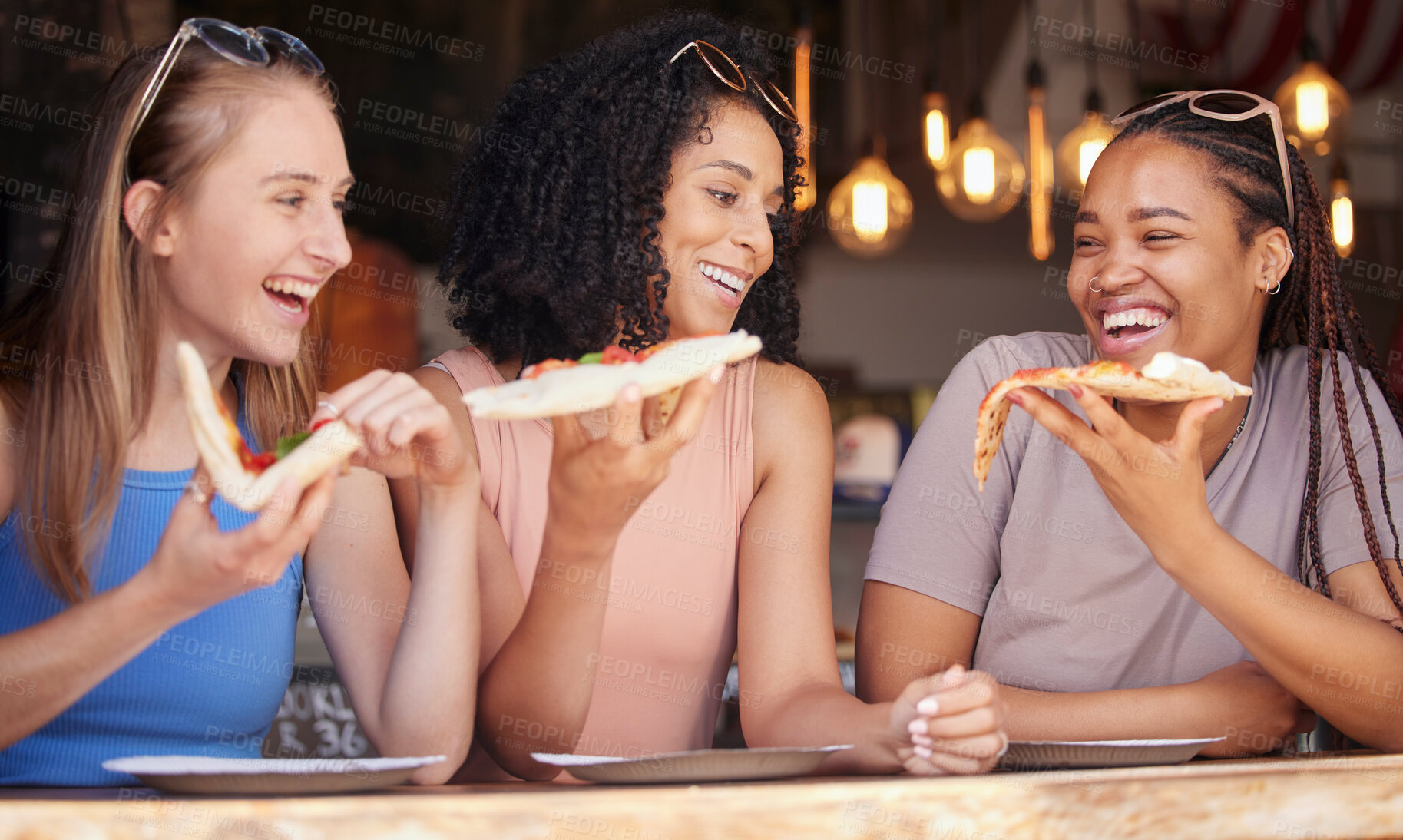 Buy stock photo Woman, friends and laughing for pizza, food or eating at funny restaurant together in friendship. Happy hungry women laugh and smile for fun date, socializing or bonding at cafe enjoying Italian meal