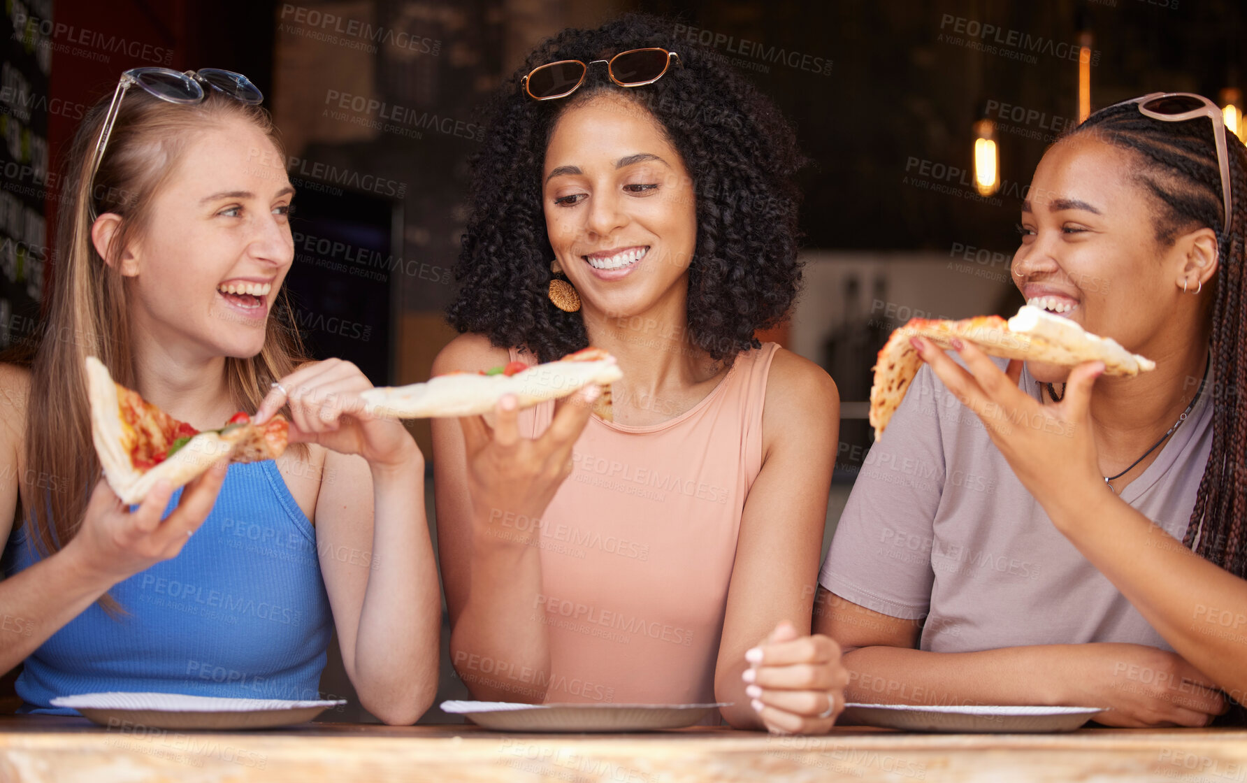 Buy stock photo Woman, friends and smile for pizza, food or eating at restaurant together in friendship. Happy hungry women smiling and relaxing on fun date, socializing or bonding at cafe enjoying Italian meal