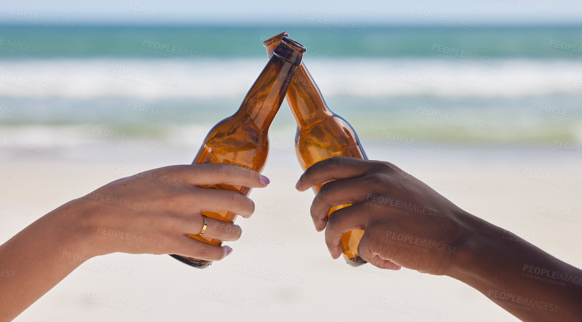 Buy stock photo Hands, beer and beach with a couple toast outdoor during summer vacation or holiday in nature together. Cheers, alcohol or celebration with a man and woman drinking while bonding by the ocean or sea