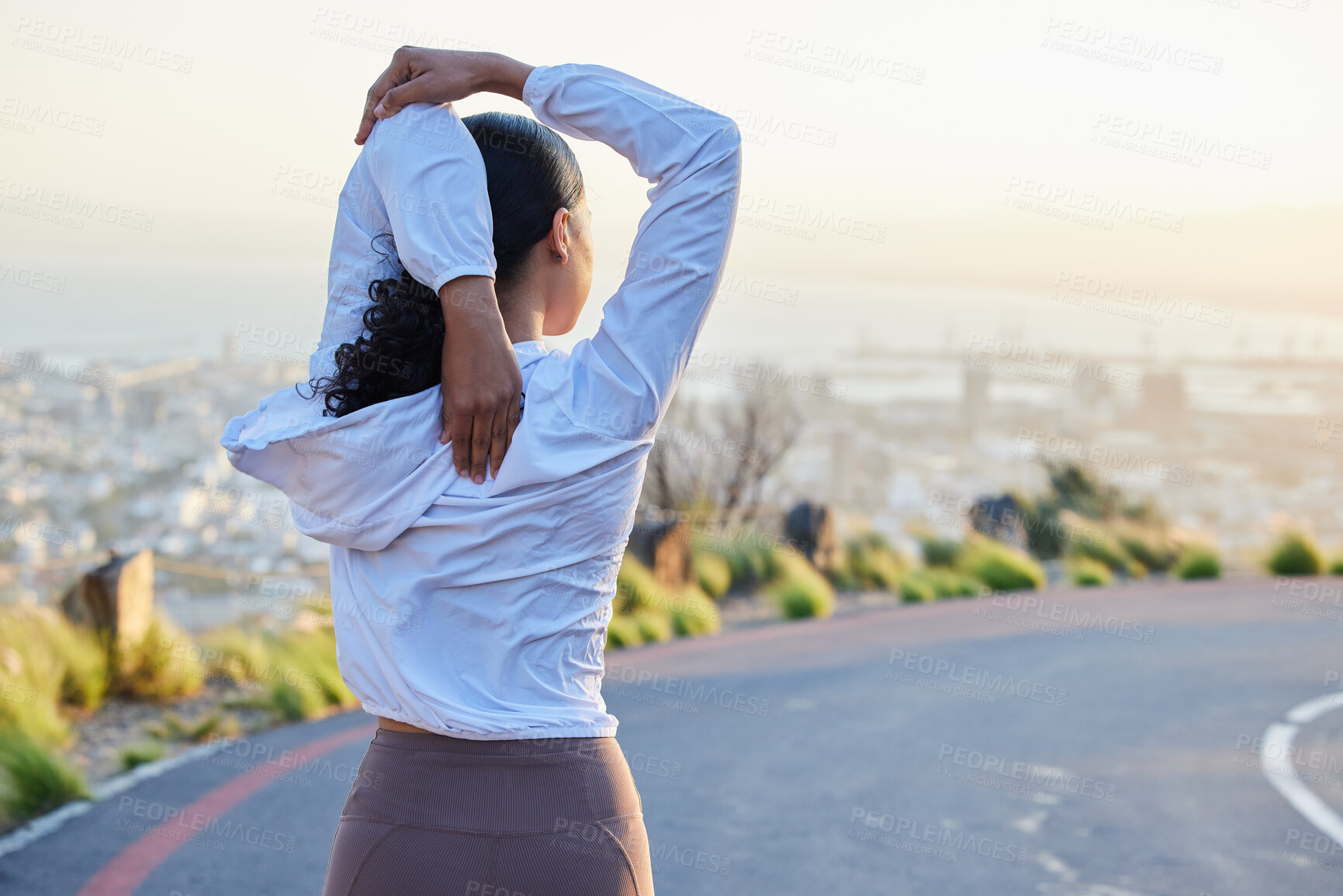 Buy stock photo Fitness, stretching and arm by woman rear view in road for running, training and exercise at sunset. Runner, stretch and back of girl at sunrise for cardio, marathon or outdoor practice run workout