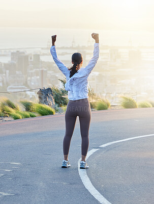 Buy stock photo Run celebration, woman winner and fitness goal of a excited and happy runner on a road. Cityscape, freedom and motivation of a female athlete back feeling exercise success from running and training