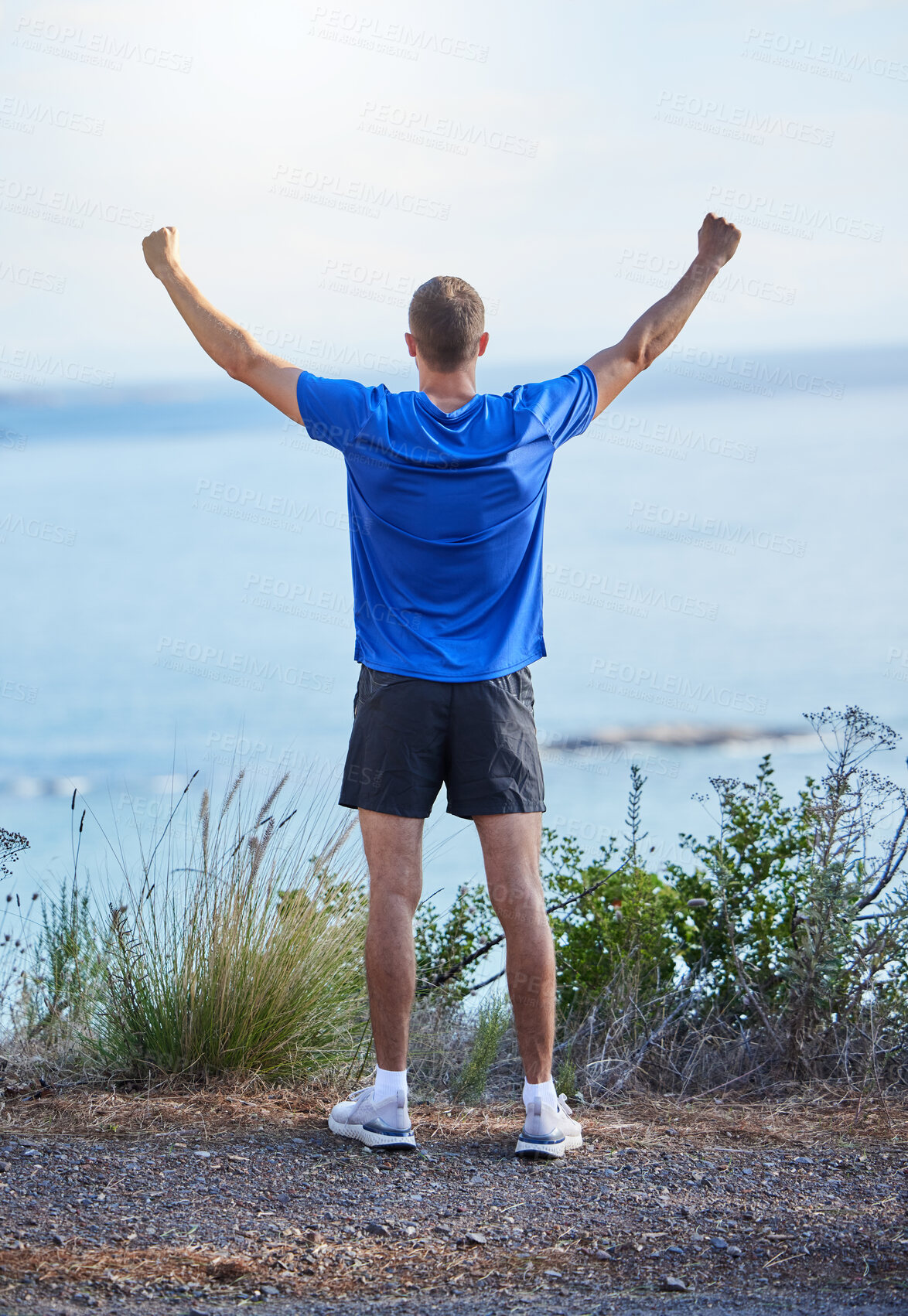 Buy stock photo Success, freedom and running with back of man in nature for health, fitness and marathon training. Workout, exercise and winner with runner on mountain path for cardio, adventure and celebration