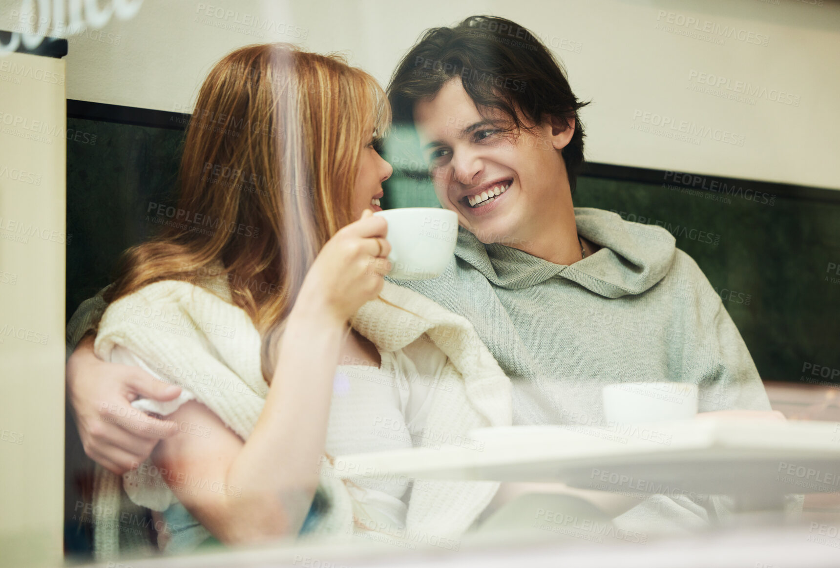 Buy stock photo Gen z, student couple and coffee shop window of date together with love and care in cafe. Restaurant, relax and happiness of a teen man and girl with happy smile from teenager relationship in morning