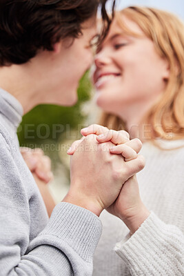 Buy stock photo Love, couple and hands together for partnership, trust and happiness for relationship, romance and bonding. Romantic, happy man and woman with hand, loving and cheerful for support, smile and dating