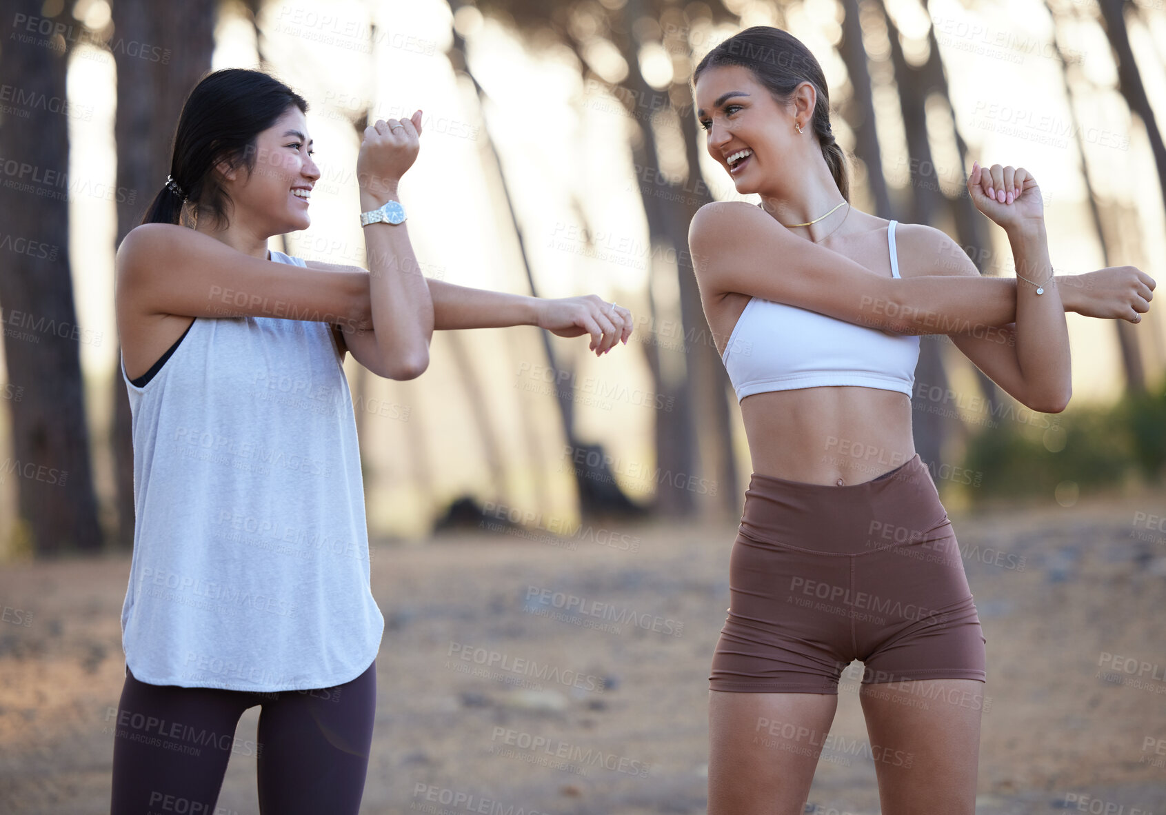 Buy stock photo Fitness, forest and stretching with woman friends getting ready for a cardio or endurance run outdoor. Exercise, running or nature with a female athlete and friend doing their warm up for a workout