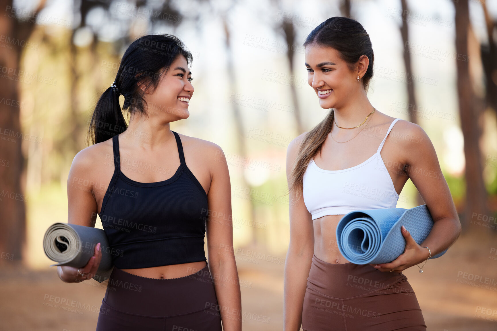 Buy stock photo Yoga women, outdoor and exercise in nature in nature talking about fitness, exercise and wellness. Friends together in a forest for a workout, training and energy for mental health, peace and zen