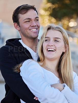 Buy stock photo Relax, happy and couple at the beach for a date, bonding and quality time. Laughing, romantic and man and woman with affection, hugging and happiness in nature for a vacation or relaxing together