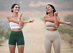 Stretching, laughing and women in mountains, workout and wellness with smile, balance and motivation. Female athletes, friends and happy girls stretch arms, training in nature or warm up for practice