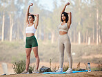 Fitness, stretching or friends in nature in yoga exercise workout or arms training in healthy lifestyle. Athlete girls, women or sports people exercising for wellness or body goals together in summer