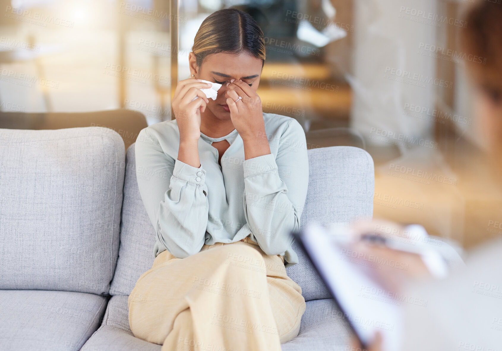 Buy stock photo Mental health, woman and employee in therapy session, crying and conversation in office. Female, patient and lady on sofa, depression or counselling for stress, grief or loss with anxiety or recovery