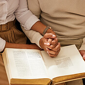 https://photos.peopleimages.com/picture/202302/2652944-bible-holding-hands-and-reading-with-a-black-couple-together-in-the-home-for-religion-faith-or-belief-in-god.-jesus-pray-or-book-with-a-christian-man-and-woman-learning-about-the-spiritual-christ-box_175_175.jpg