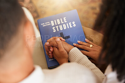 Religion, studying and couple holding hands with a bible for worship, prayer and trust in relationship. Love, care and man and woman with affection while learning about God, faith and Christianity