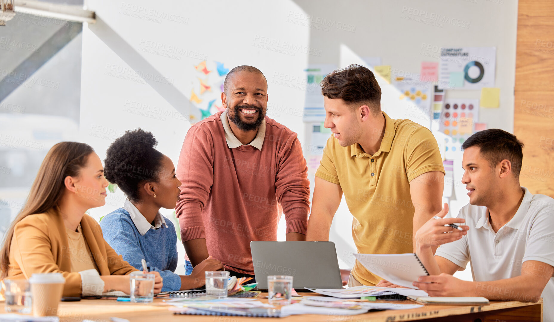 Buy stock photo Creative presentation, teamwork and black man in meeting talking, in discussion and brainstorming ideas. Leader, collaboration and business people for planning, marketing strategy and brand project