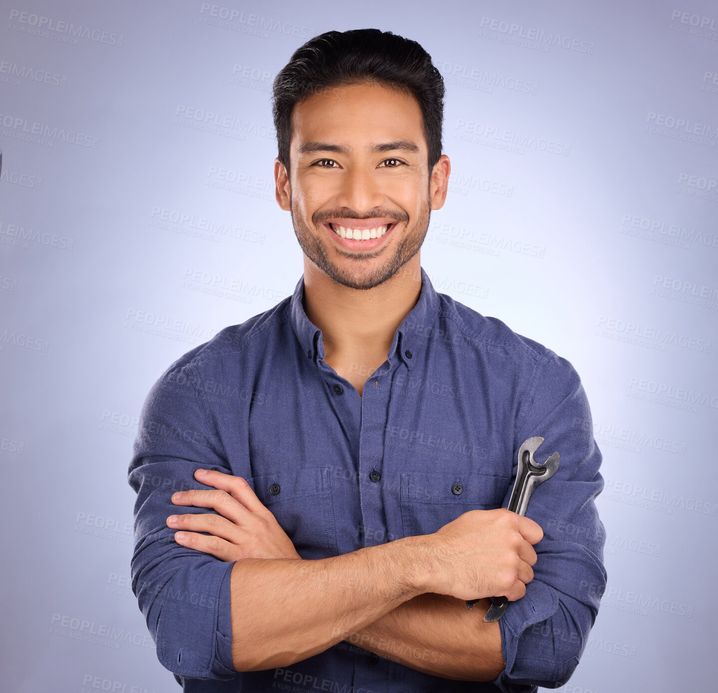 Buy stock photo Man, studio and portrait with tools or spanner for handyman, maintenance or repair work with a smile. Happy asian handy man person smile on purple background for engineer, mechanic or technician job