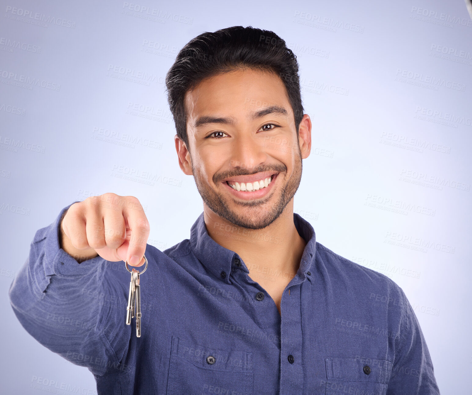 Buy stock photo House keys, happy and portrait of a man in a studio with confidence after buying property. Happiness, proud and successful male model or new homeowner from Mexico isolated by a purple background.