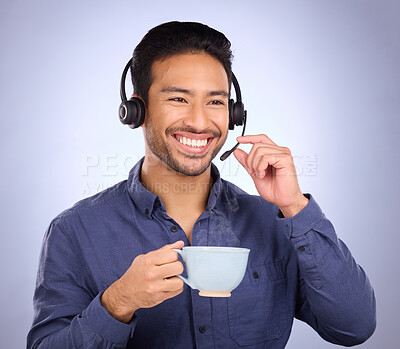Buy stock photo Happy call center man isolated on studio background for technical support, communication services and coffee for productivity. Asian consultant, business agent or person talking on a headset with tea