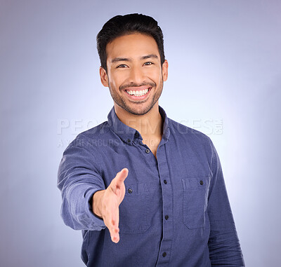 Buy stock photo Hand shake, welcome and portrait of a business man with happiness from deal agreement. Isolated, blue background and studio with a young man ready for shaking hands for onboarding or yes hand sign