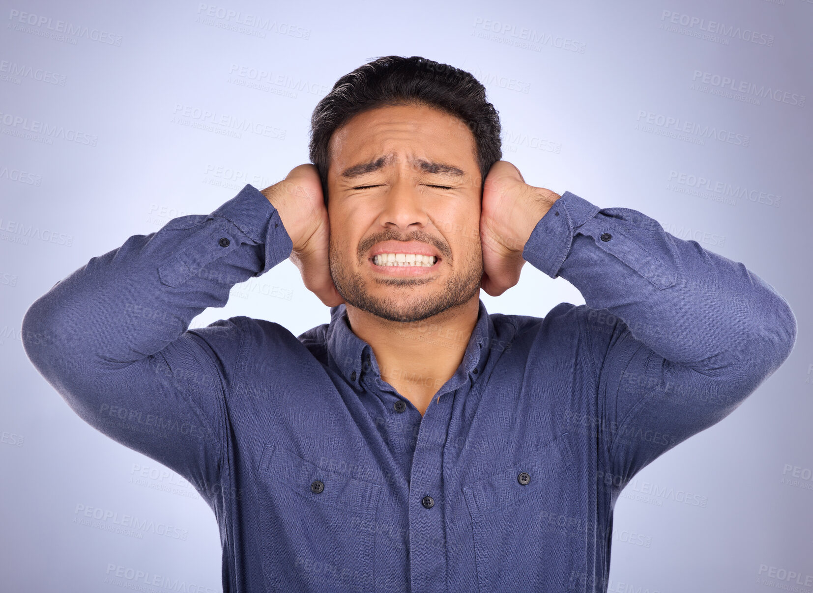 Buy stock photo Stress, noise and man closing his ears in studio isolated on a gray background. Loud, mental health and upset, angry or mad business person with headache, depression or anxiety from noisy sound.