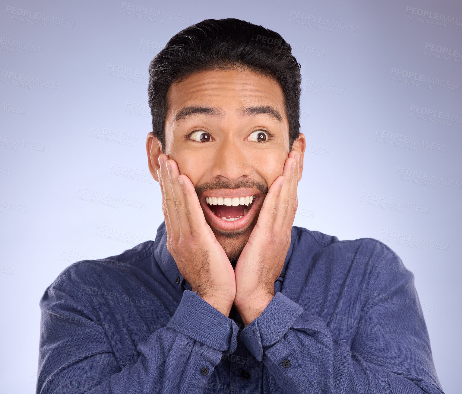 Buy stock photo Face, wow and surprise with a man in studio on a gray background looking shocked at an announcement. Hands, notification and omg with a handsome young male feeling surprised or in awe at good news