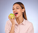 Portrait of woman eating apple isolated on studio background for healthy teeth, wellness or nutrition breakfast. Vegan business person or black model with green fruits or food, dental care and beauty