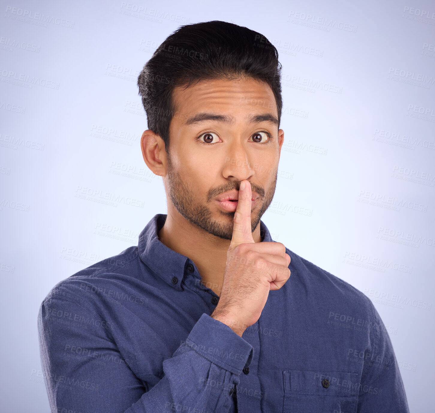 Buy stock photo Man, portrait and finger on lips for secret, gossip or silence in studio with blue background. Face of a asian model person with hand on mouth for emoji sign to surprise, hush or quiet for privacy