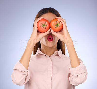 Buy stock photo Woman, tomato and covering eyes in studio for healthy food, vegan diet and vegetable in hands. Face of a model person with red vegetables for health, wellness and skin care on purple background