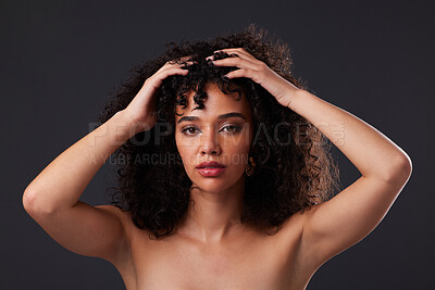 Portrait, natural and hair by black woman in studio for beauty, treatment and body care on black background. Face, girl and curly afro model relax with luxury, soft and glowing skin while isolated