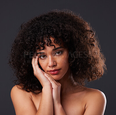 Buy stock photo Portrait, natural and beauty by black woman in studio for hair, treatment and body care on black background. Face, girl and curly afro model relax with luxury, soft and glowing skin while isolated 