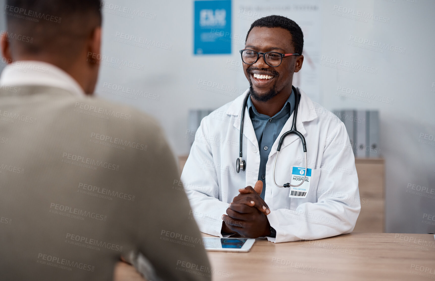 Buy stock photo Black man doctor with patient in consultation office for healthcare advice, services and professional support. Medical worker talking, consulting and discussion with client or person in health clinic