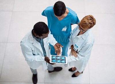 Buy stock photo Doctor, tablet and meeting in healthcare above on screen for research, anatomy or surgery analysis. Medical professional team holding touchscreen and brain x ray display in collaboration or planning