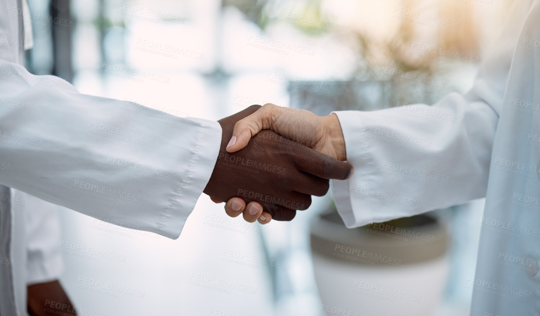 Buy stock photo Doctor, handshake and partnership in healthcare, agreement or deal for collaboration, teamwork or unity. Hand of medical professionals shaking hands for meeting, greeting or success in solidarity
