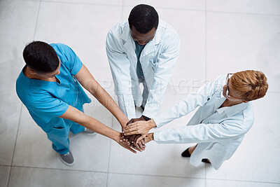 Buy stock photo Doctor, meeting and hands together above for collaboration, healthcare or teamwork unity in trust. Top view of doctors piling hand in medical agreement, strategy or partnership for team solidarity