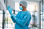 Surgeon, doctor with gloves and surgery with face mask and health, man in ppe for safety, operation and ready for procedure. Cardiovascular, clean scrubs and person in clinic with male physician