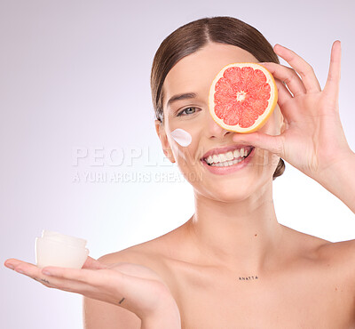 Buy stock photo Woman, face and grapefruit with moisturizer for skincare nutrition, cream or healthy diet against gray studio background. Portrait of female with fruit and creme for natural organic facial cosmetics