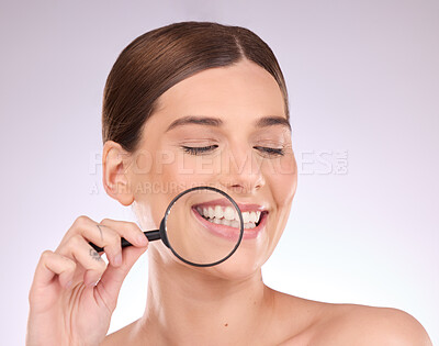 Buy stock photo Magnifying glass, teeth or woman with dental, smile or natural face beauty in oral health hygiene routine. Search, tooth or happy girl model with lens for wellness, clean mouth or treatment in studio